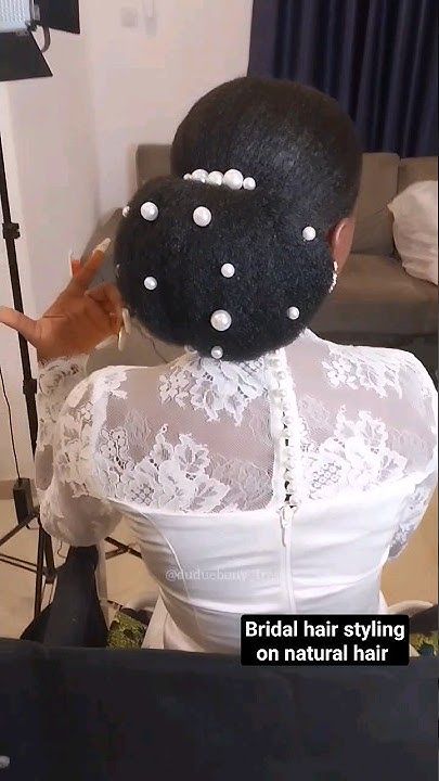Low natural 4C puff decorated with pearl pins for a wedding