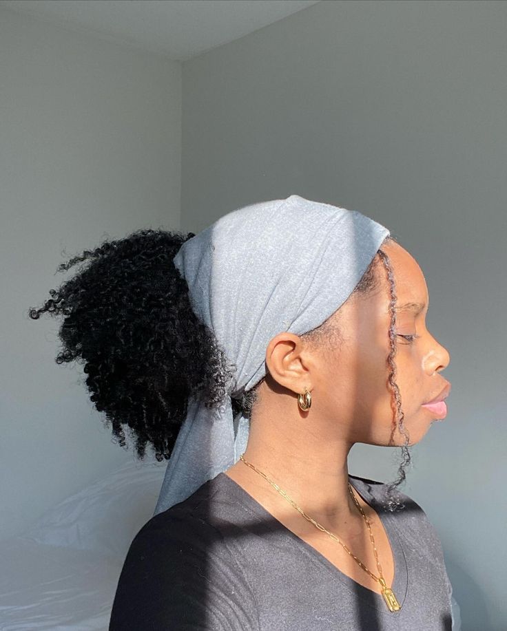 Low afro puff with scarf on natural 4C hair