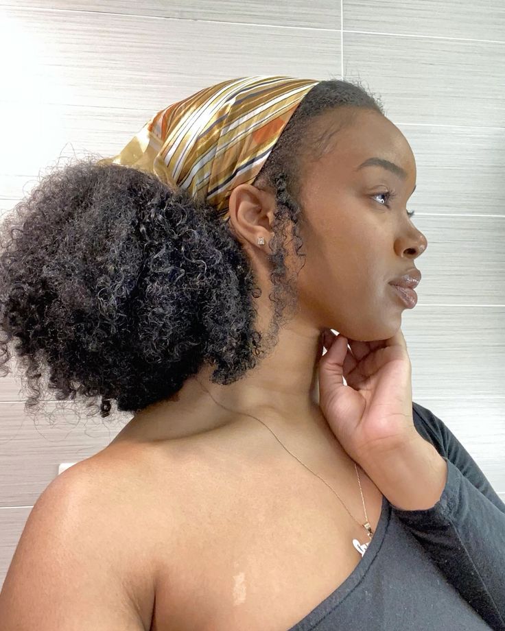 Low afro puff with scarf on natural 4C hair