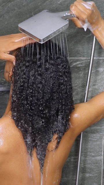 Natural 4C hair evenly absorbing water during wash day.
