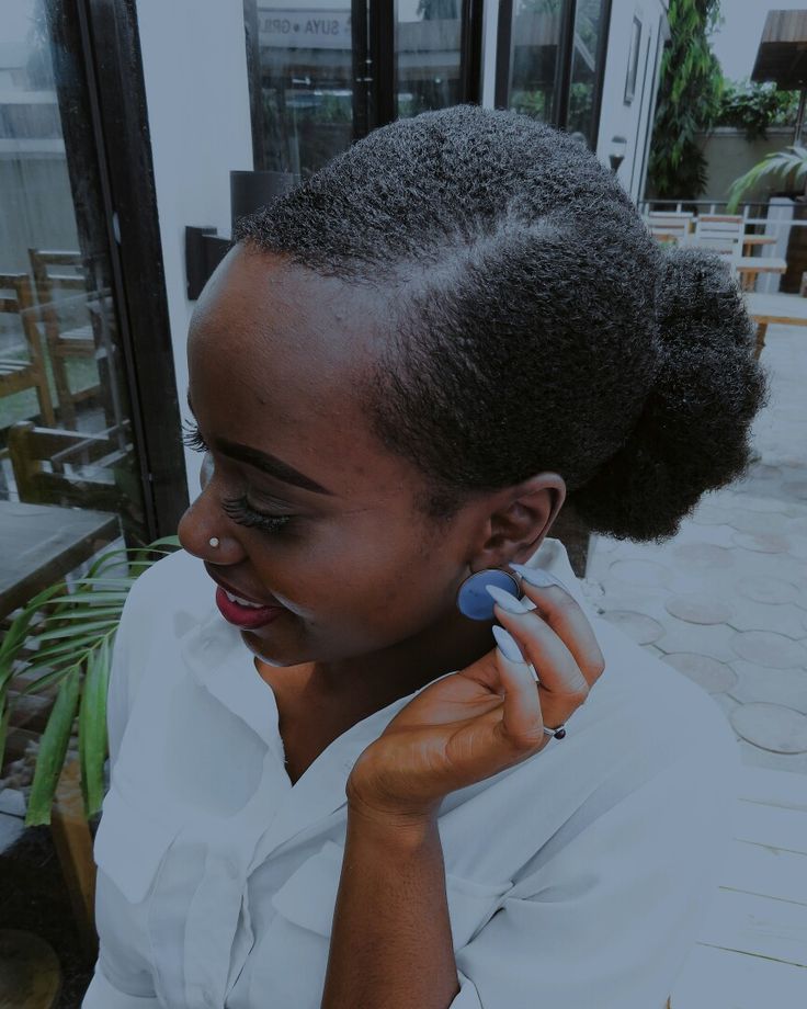 Middle-parted low bun on natural 4C hair