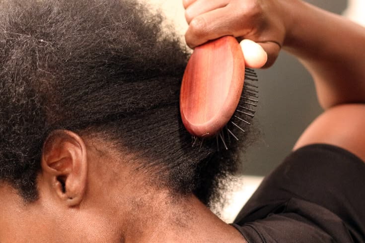 Natural 4C hair showing signs of excessive manipulation