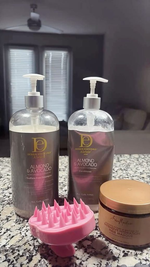 A simple scalp-care setup featuring shampoo, conditioner, and clean hair accessories.