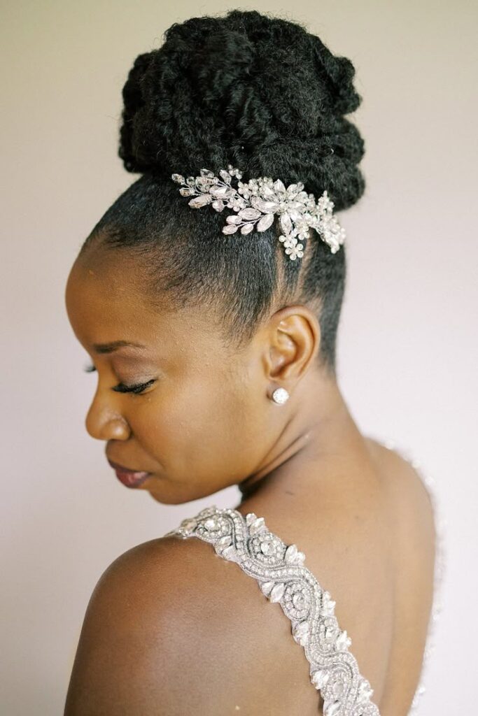 Elegant sculpted high bun on natural 4C hair for a wedding