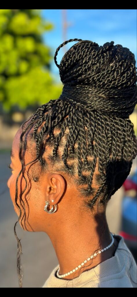 protective Senegalese twists styled into a bun
