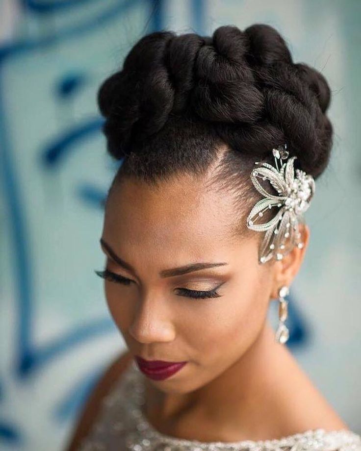 High bun with side part on natural 4C hair