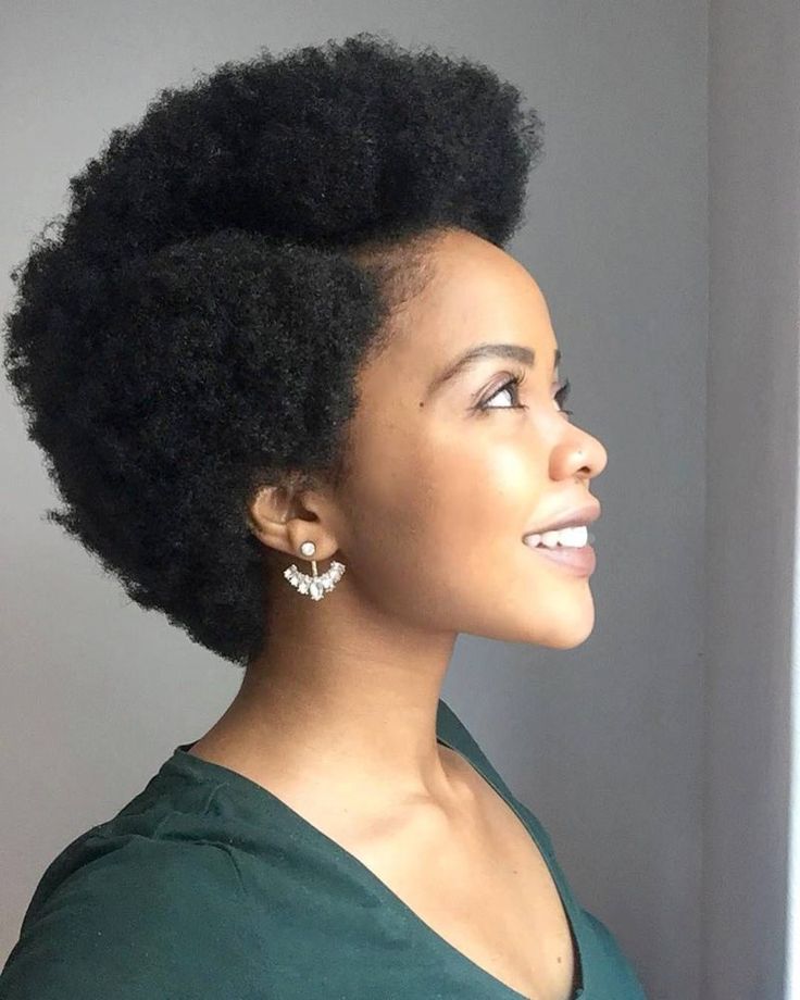 Natural 4C hair styled in a voluminous side-parted afro