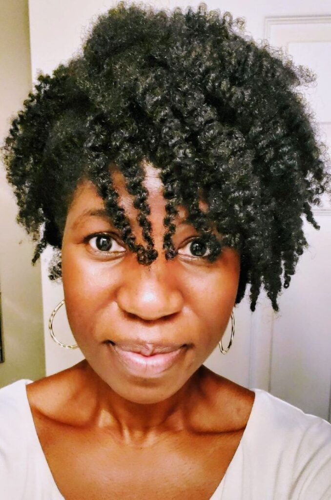 Side-swept natural 4C afro