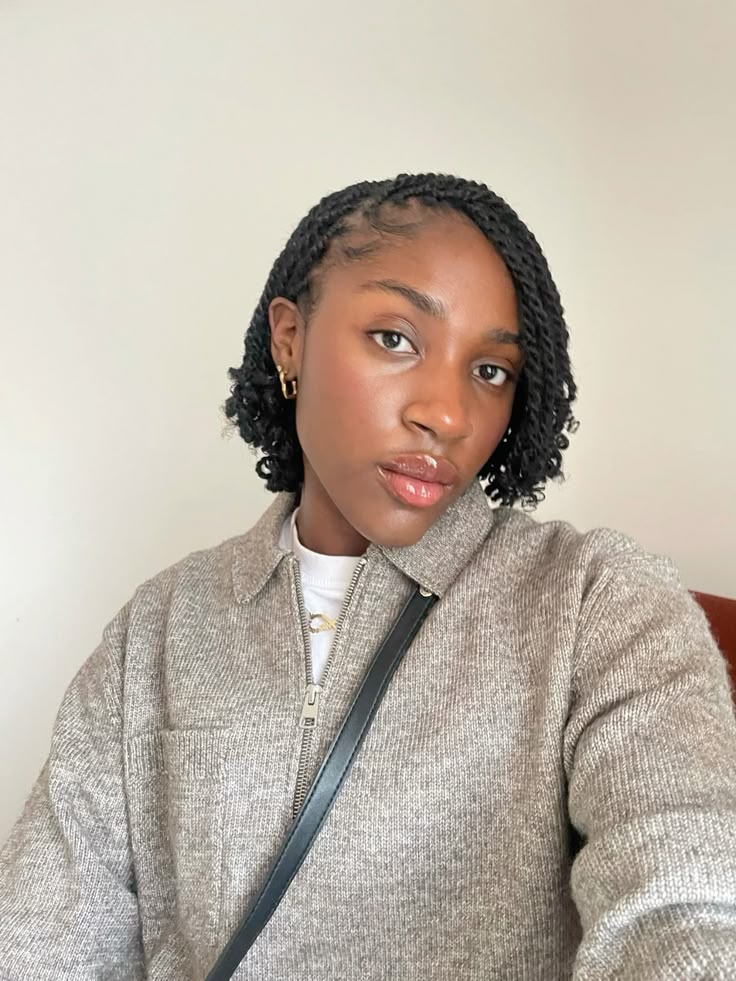 Natural 4C twists styled into a cute side-swept look