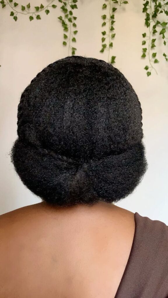 Simple tucked protective style on natural 4C hair