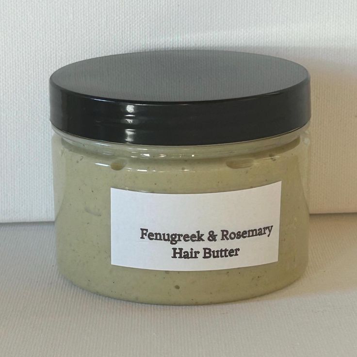 A labeled airtight jar of homemade hair butter stored in a cool, dry area.