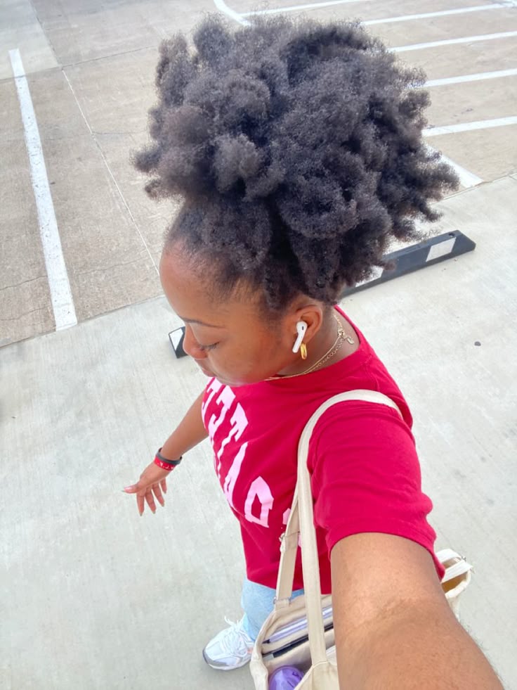 Natural 4C hair styled in an elongated stretched puff
