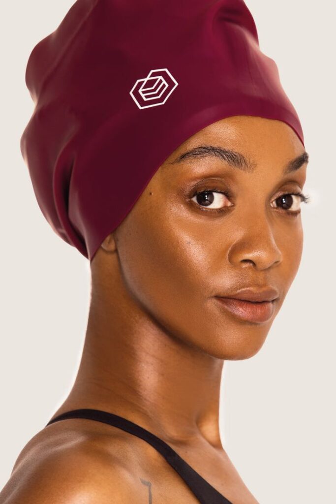 woman wearing swimming cap before swimming