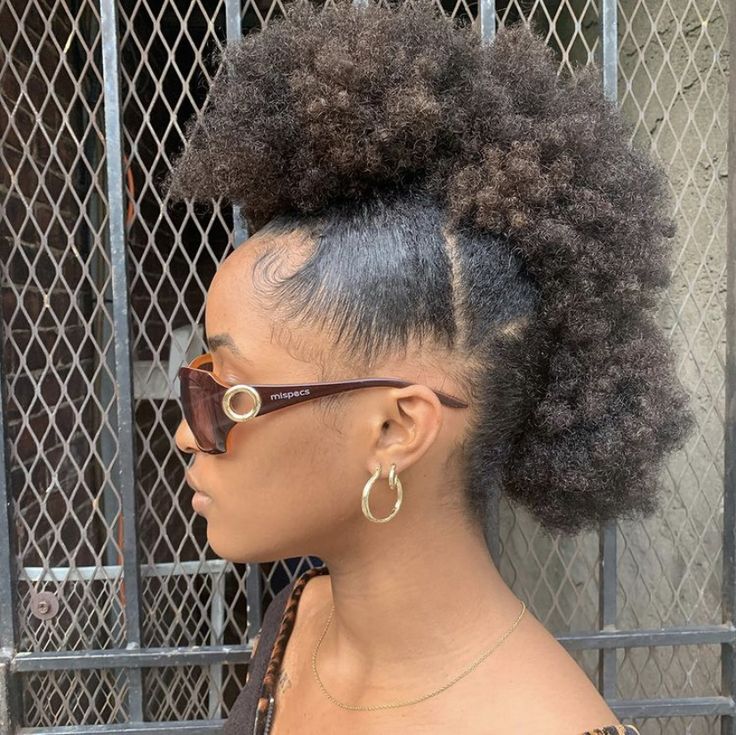 Natural 4C hair styled into three connected puffs
