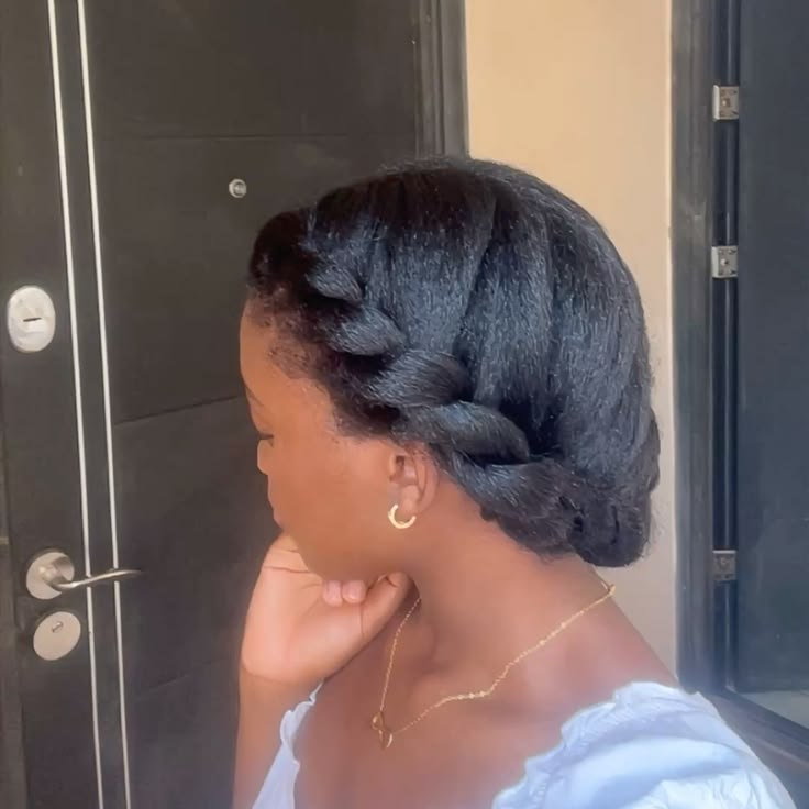 Twist-and-tuck updo on natural 4C hair