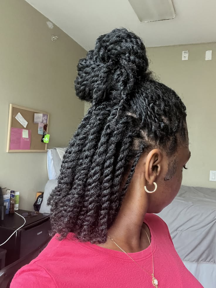 Twists styled into a half-up bun