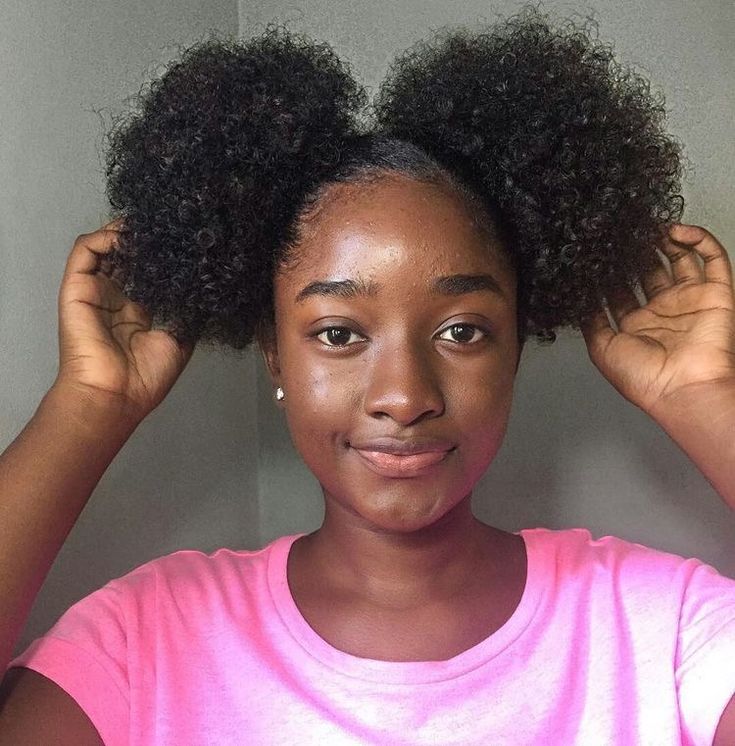 Two afro puffs on natural 4C hair
