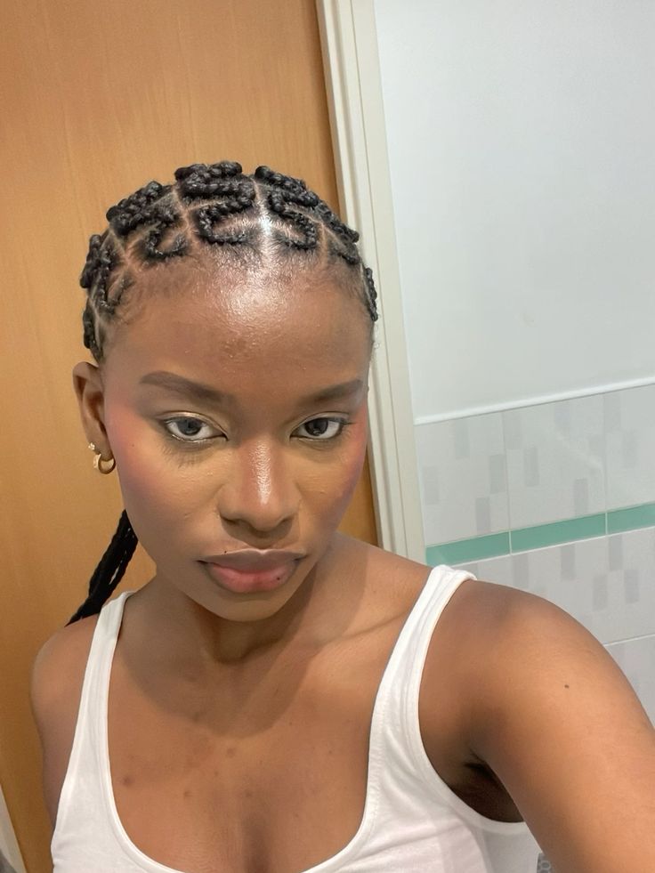 Natural 4C hair with zigzag cornrow design