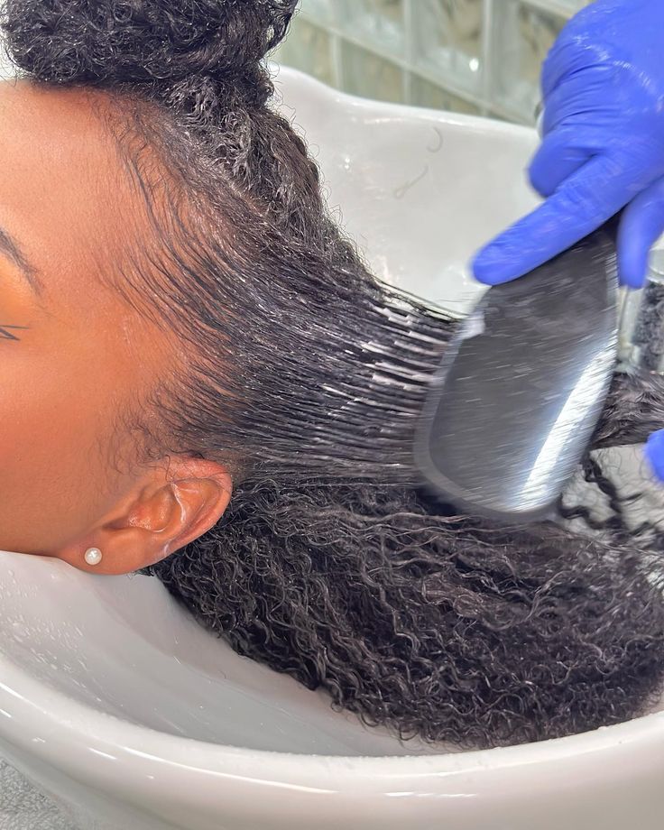 Natural hair being prepared for a coloring treatment