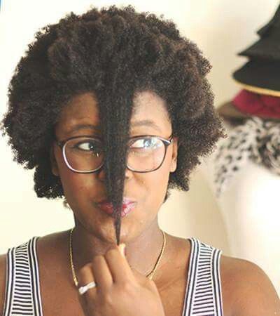 Natural 4C hair showing shrinkage in humid weather