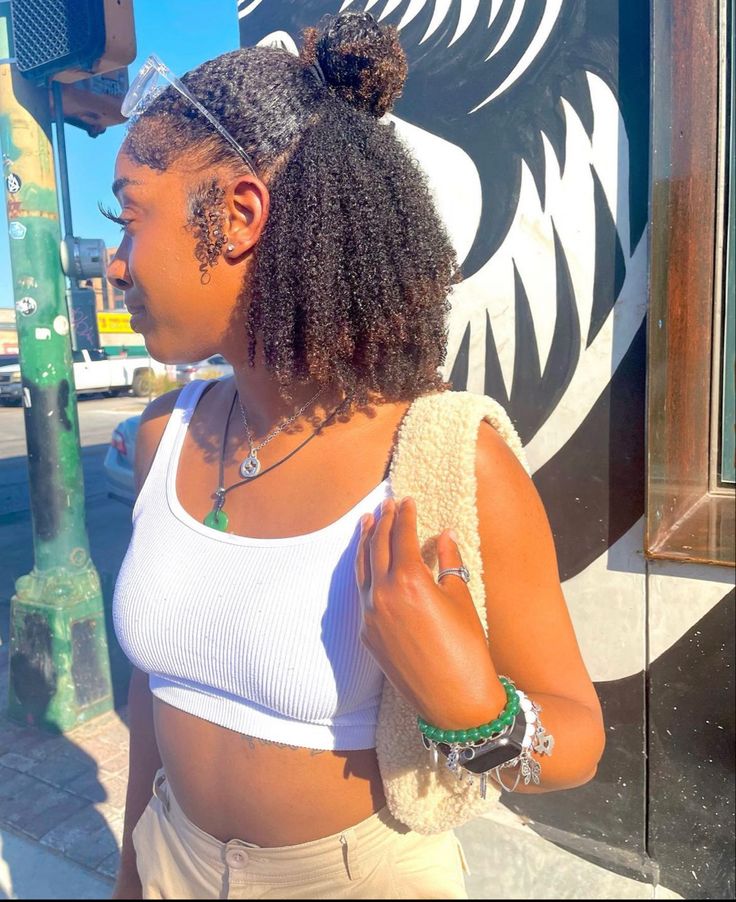 Woman wearing a practical natural hairstyle for summer activities