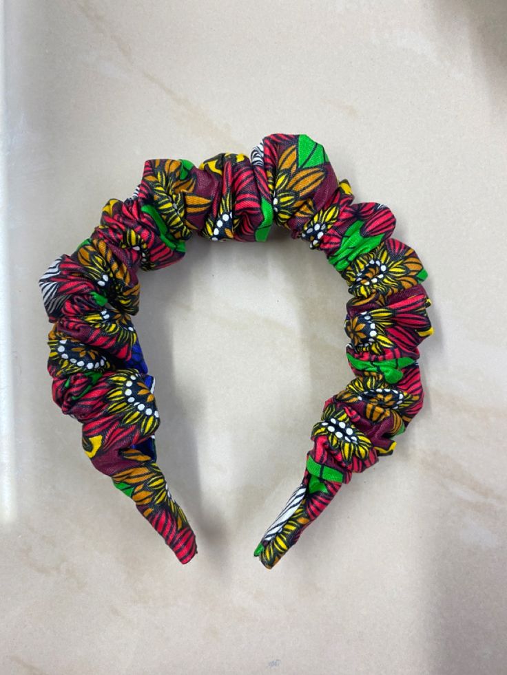 Woman wearing an Ankara headband with natural hair