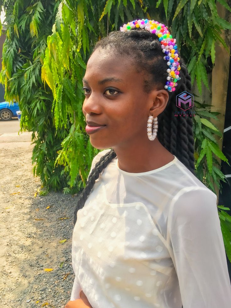 Woman wearing a beaded headband with natural hair