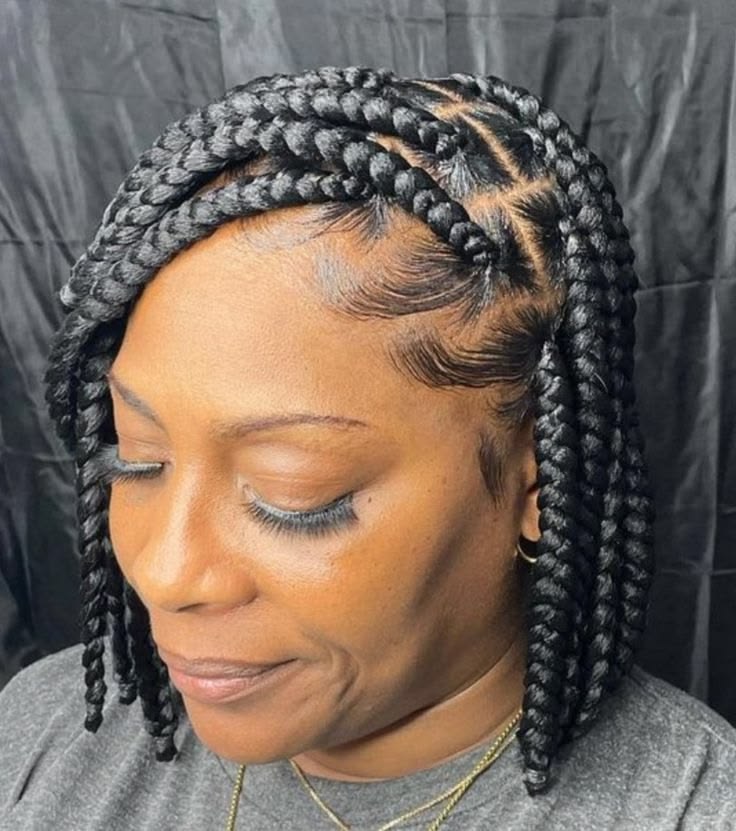 Woman with shoulder-length bob box braids on natural hair