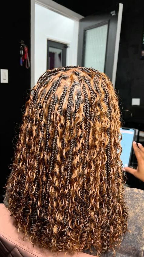 Woman wearing bohemian braids with loose curls