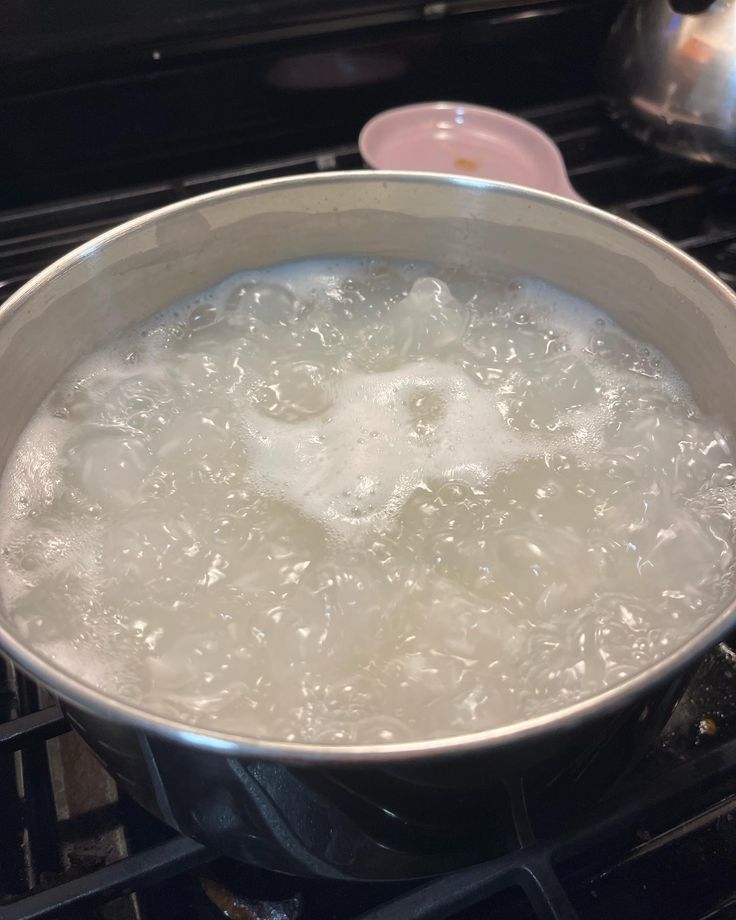 rice water boiling in a pot