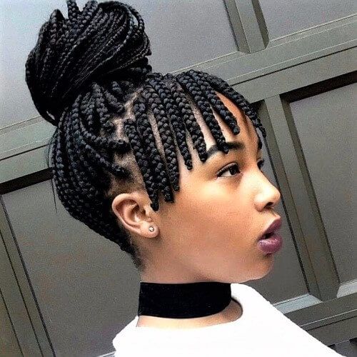 Woman wearing braided bangs with natural 4C hair
