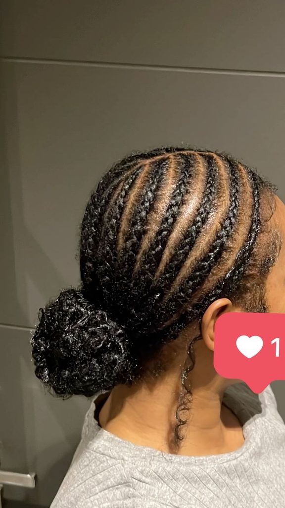 Woman wearing an elegant braided bun on natural hair
