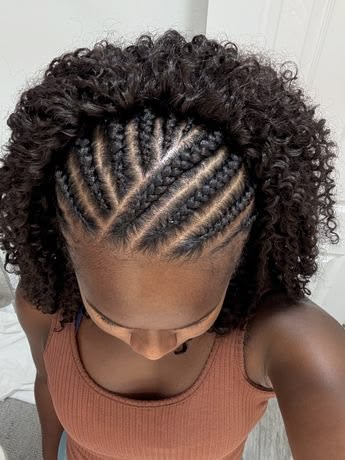 Woman wearing a braided crown with loose natural curls