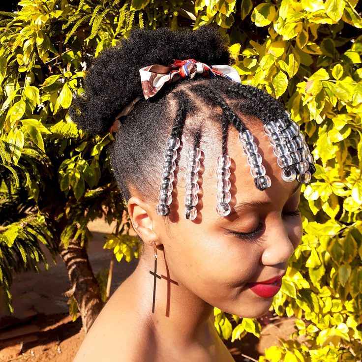 Woman wearing a braided crown with a natural puff