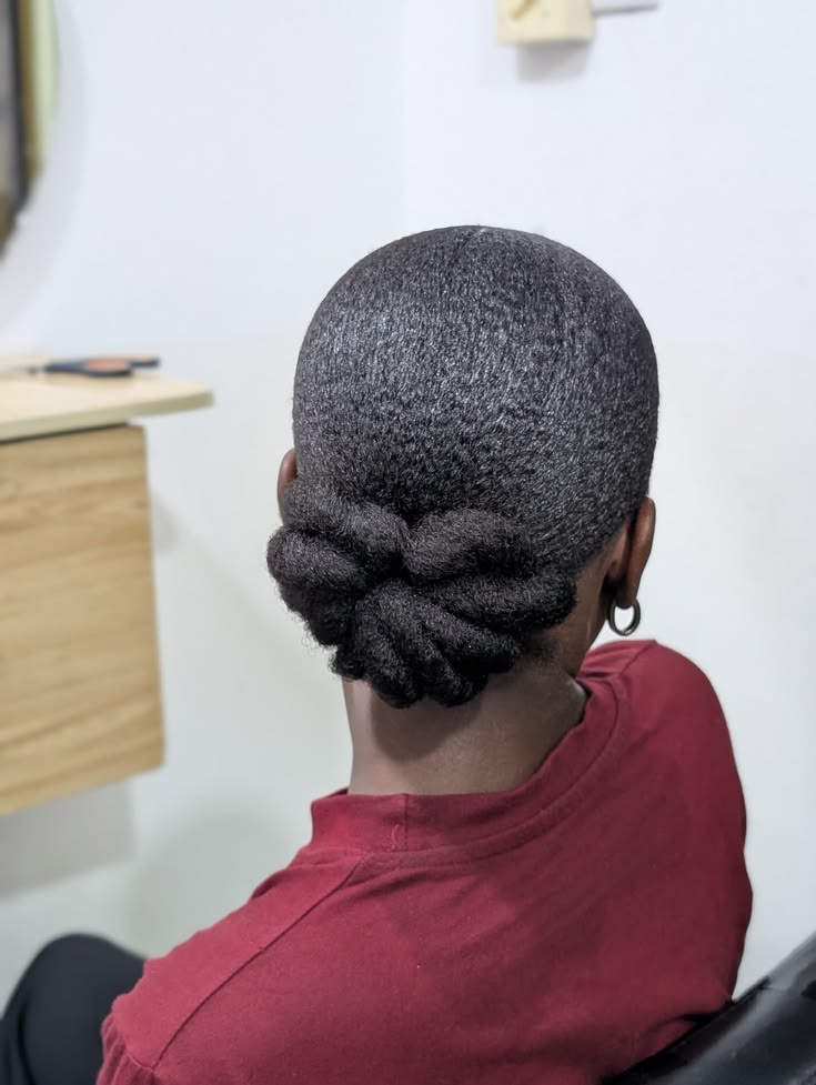 Braided low bun school hairstyle for natural 4C hair