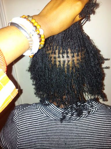 Braided sections used to begin a natural loc journey