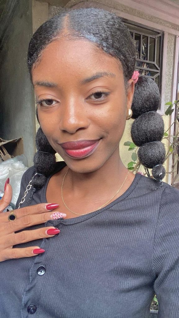 Natural 4C puff hairstyle with a bubble ponytail effect