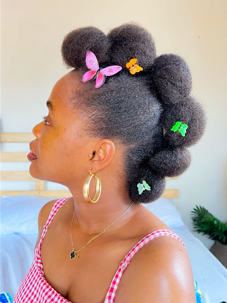 Natural hair decorated with colorful butterfly clips