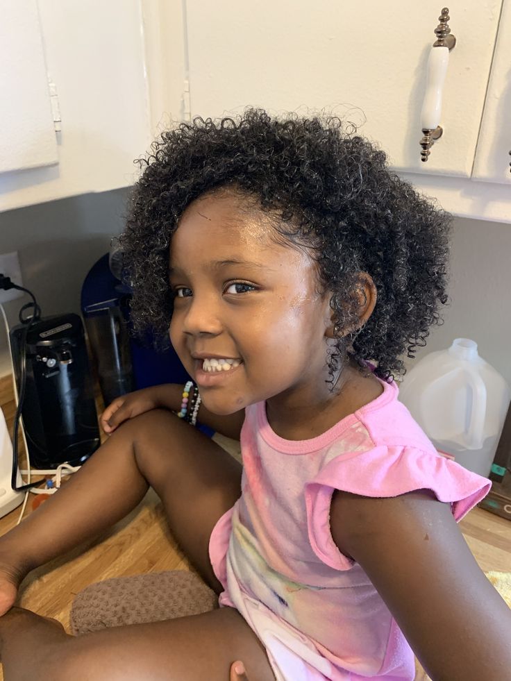 Healthy moisturised child's 4C hair after gentle detangling and conditioning