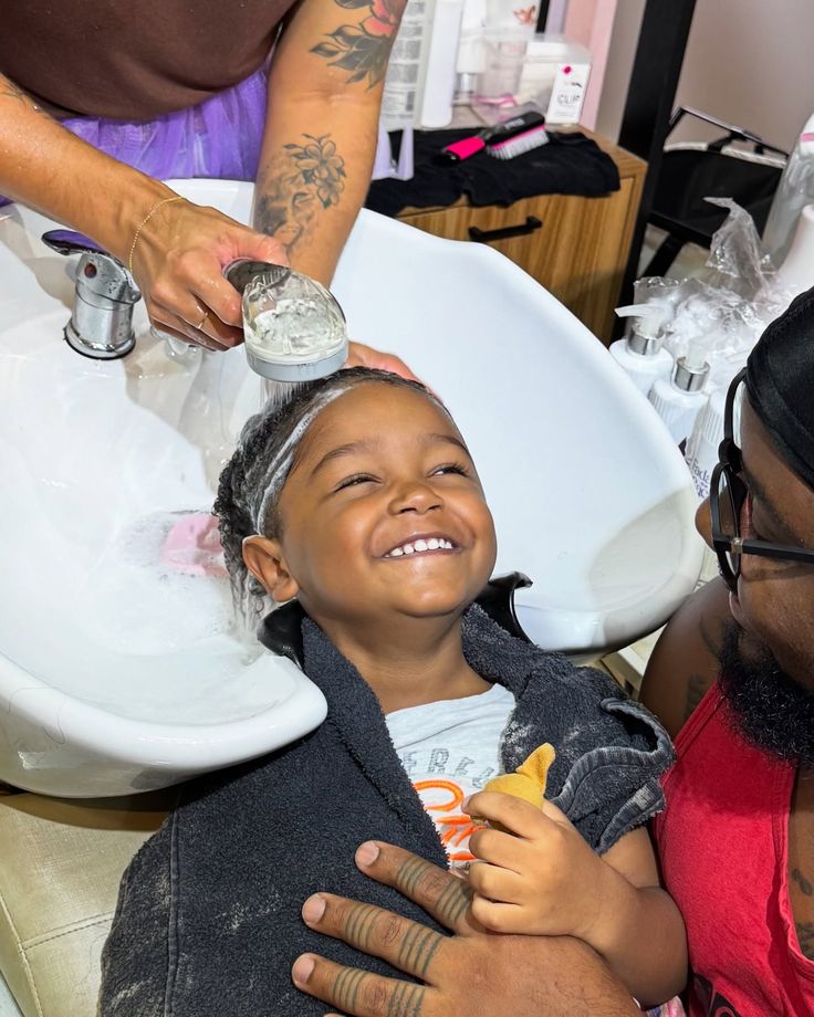 a mother washing her child's hair