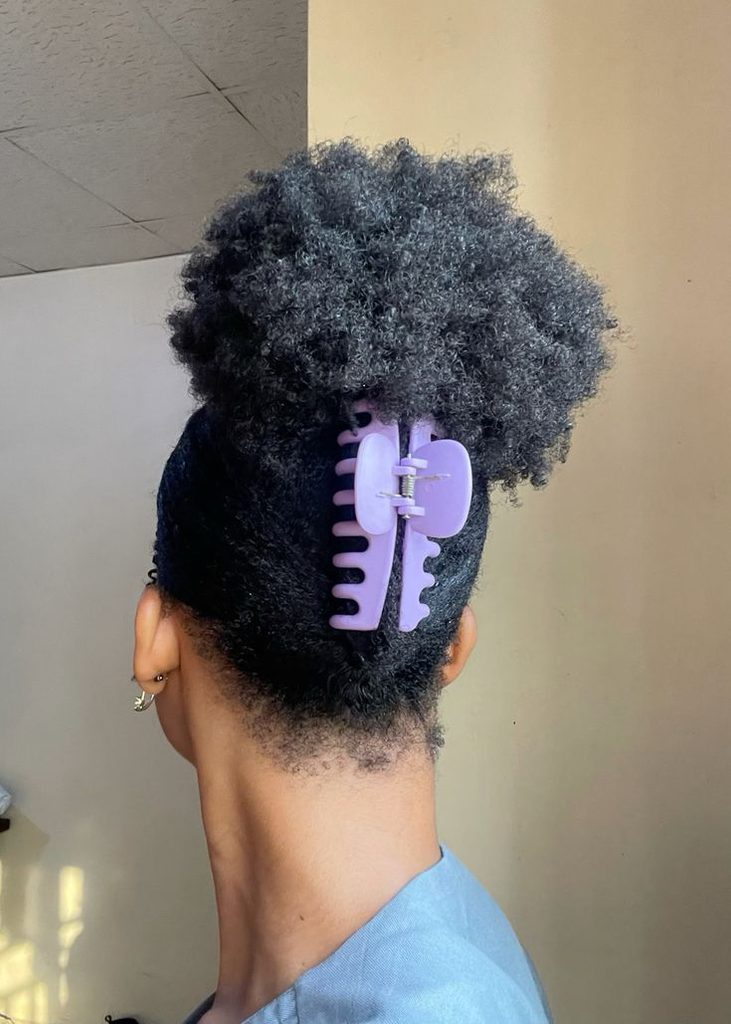 Natural 4C puff hairstyle decorated with a claw clip