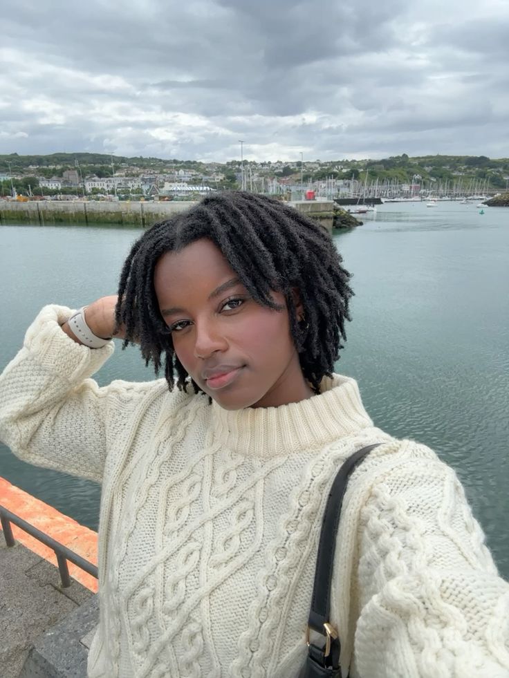 Woman confidently wearing healthy natural locs at the beginning of her loc journey