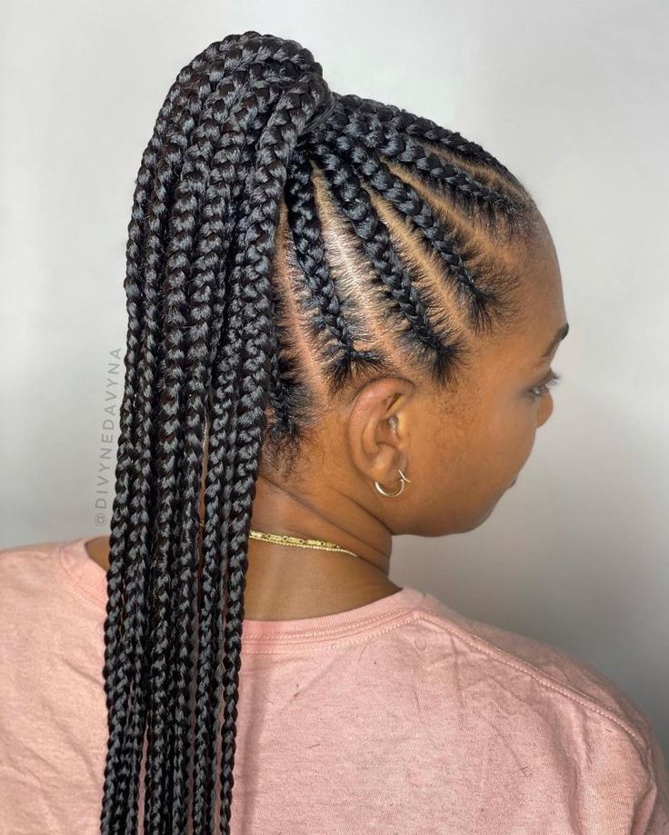 Woman wearing cornrows gathered into a ponytail for rainy day