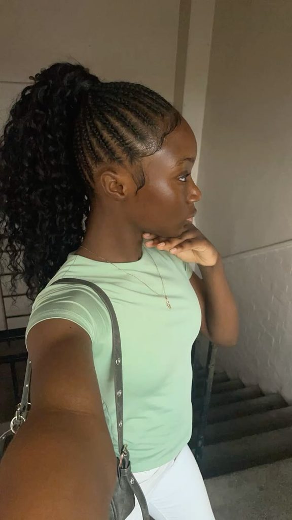 Cornrow ponytail with curly extensions
