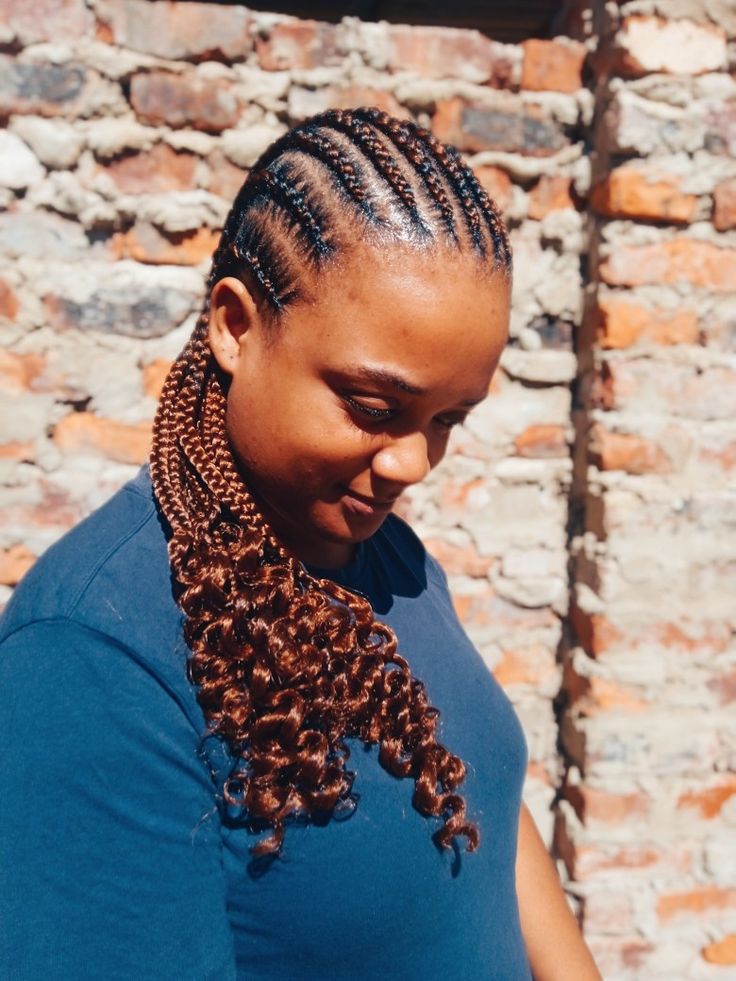 Cornrows with curly ends hairstyle