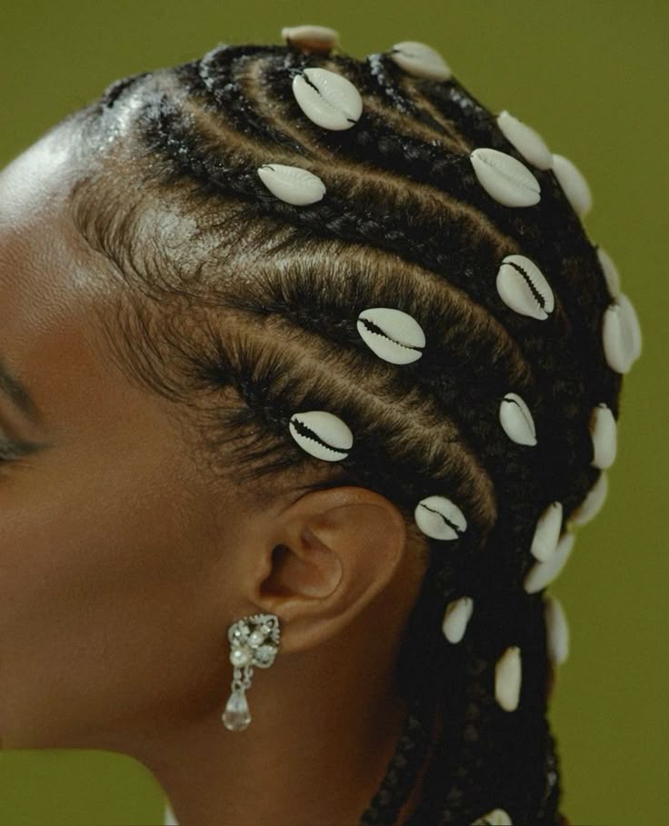 Natural braids decorated with cowrie shells