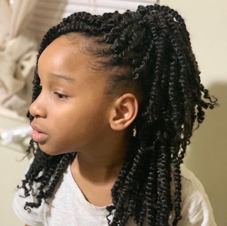  Black child wearing crochet-style twists as a protective hairstyle
