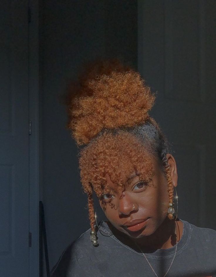 Natural 4C puff hairstyle with a defined curly bang