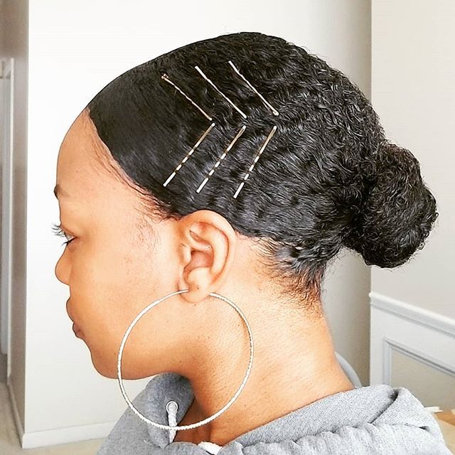 Natural hairstyle decorated with decorative bobby pins