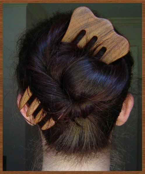 Natural hair updo decorated with a decorative hair fork